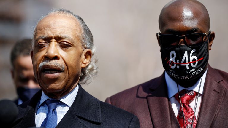 Rev. Al Sharpton prays alongside Philonise Floyd outside the Hennepin County Government Center on the seventh day in the trial of former police officer Derek Chauvin, who is facing murder charges in the death of George Floyd, in Minneapolis