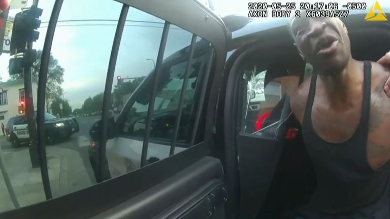 An image from police body cam video as officers attempt to place George Floyd in a police vehicle. Pic: AP