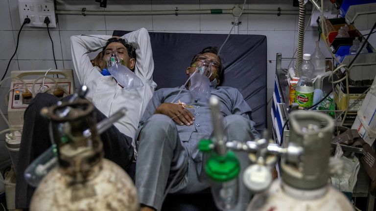 Due to a shortage of beds in hospitals, patients are forced to share beds as they received treatment for the virus