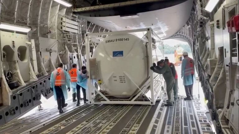 An oxygen tank is loaded into an aircraft to supply hospitals in India running out of supplies amid coronavirus disease (COVID-19) outbreak, at the tarmac of Changi Airport in Singapore April 24, 2021 in this still image taken from video recorded on April 24, 2021. High Commission of India for Singapore/via REUTERS THIS IMAGE HAS BEEN SUPPLIED BY A THIRD PARTY. MANDATORY CREDIT. NO RESALES. NO ARCHIVES.