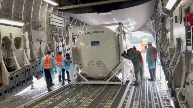 An oxygen tank is loaded into an aircraft to supply hospitals in India running out of supplies amid coronavirus disease (COVID-19) outbreak, at the tarmac of Changi Airport in Singapore April 24, 2021 in this still image taken from video recorded on April 24, 2021. High Commission of India for Singapore/via REUTERS THIS IMAGE HAS BEEN SUPPLIED BY A THIRD PARTY. MANDATORY CREDIT. NO RESALES. NO ARCHIVES.
