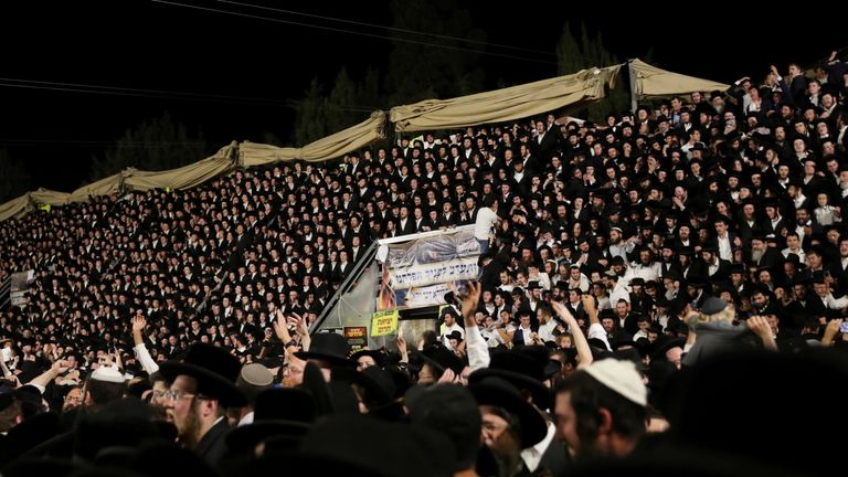 Tens of thousands are seen singing and dancing earlier at the Lag B'Omer event