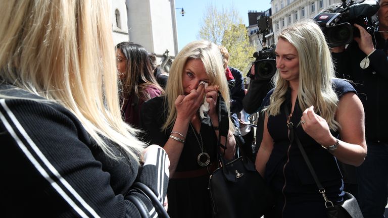 Former post office worker Janet Skinner (centre),