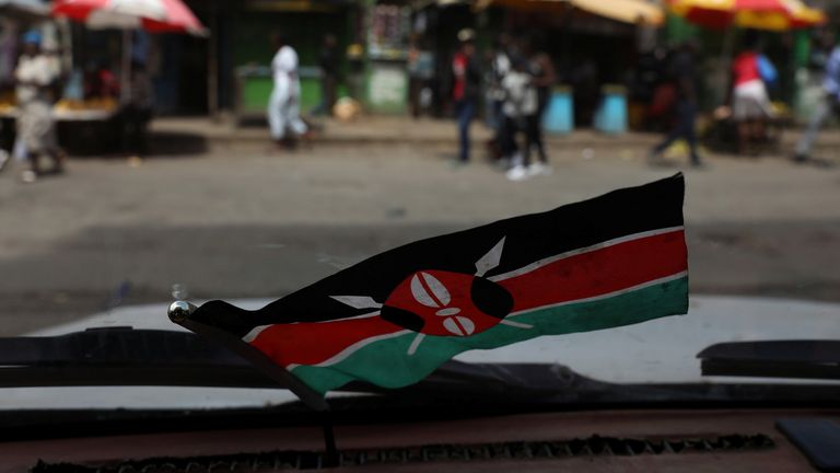 A flag of Kenya is pictured from the inside of a car in the slum area of Mathare in the capital Nairobi, Kenya, October 29, 2017. REUTERS/Siegfried Modola
