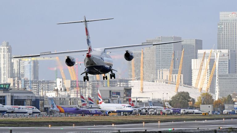 London City Airport Stock. A British Airways plane lands at London City Airport.                                                            