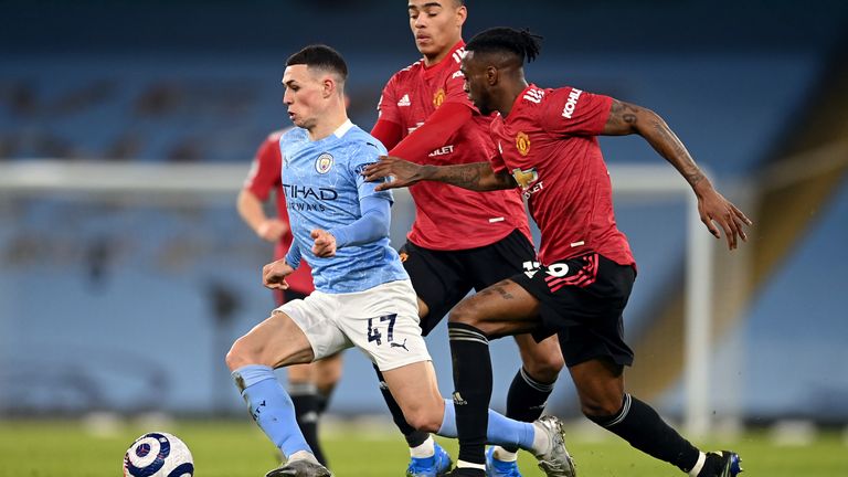 Manchester City&#39;s Phil Foden Manchester United&#39;s mason Greenwood and Aaron Wan-Bissaka (left-right) battle for the ball during the Premier League match at the Etihad Stadium, Manchester. Picture date: Sunday March 7, 2021.
