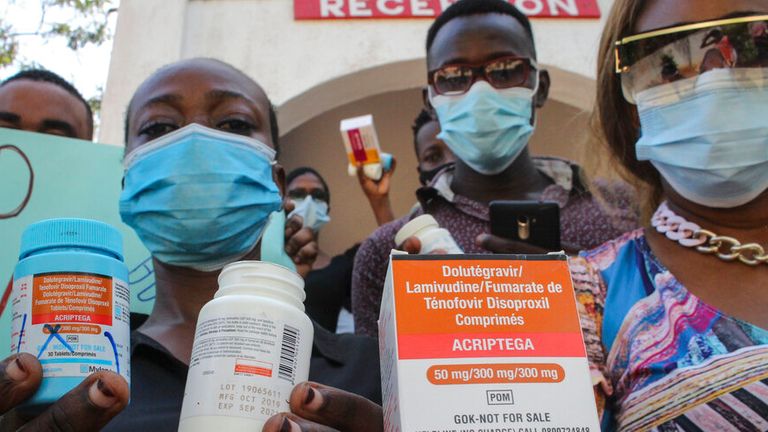 People in Mombasa hold empty containers during a demonstration over shortages of HIV drugs. Pic: AP
