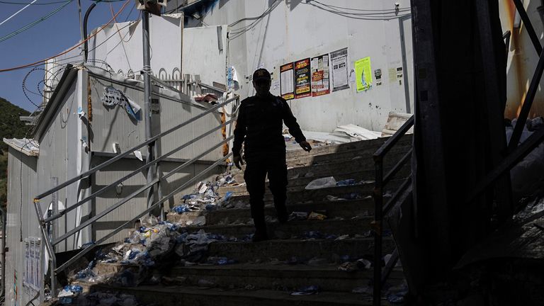 An Israeli security official at the site of the tragedy. Pic: AP