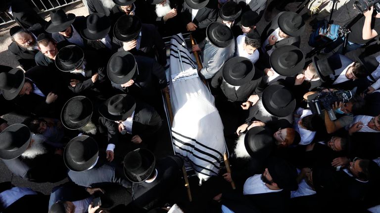 Mourners carry the body of Rabbi Eliezer Goldberg at his funeral in Jerusalem. Pic: AP