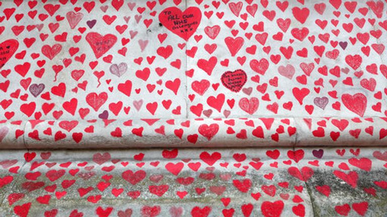 A close up of the hearts on the &#39;The National COVID Memorial Wall&#39; on the south bank of the Thames in front of St. Thomas&#39; hospital and opposite the House of Parliament in London, Sunday April 4, 2021. Hearts are being drawn onto the wall in memory of the many thousands of people who have died in the UK from coronavirus, with organizers hoping to reach their target of 150,000 hearts by the middle of next week. (AP Photo/Tony Hicks)


