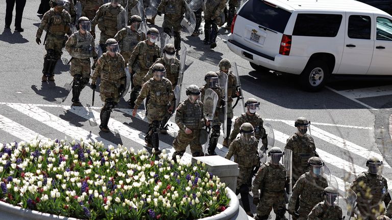 National Guard members patrol the streets surrounding the U.S. Capitol 