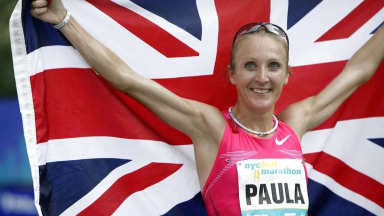 Paula Radcliffe holds up the Union Jack flag after winning the NYC half marathon