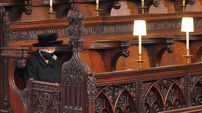 Britain&#39;s Queen Elizabeth II takes her seat for the funeral of Britain&#39;s Prince Philip, who died at the age of 99, at St George&#39;s Chapel, in Windsor, Britain, April 17, 2021. Victoria Jones/Pool via REUTERS