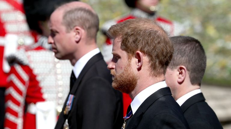 The Duke of Cambridge (left) and the Duke of Sussex (centre) follow the coffin of their grandfather, the Duke of Edinburgh, as it passes through the Parade Ground, during his funeral at Windsor Castle, Berkshire. Picture date: Saturday April 17, 2021.