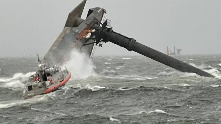 The capsized Seacor Power rolls in the waters of the Gulf of Mexico