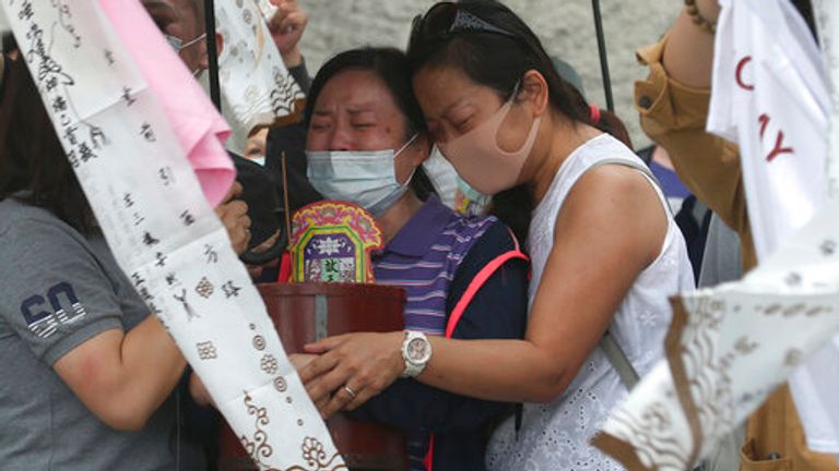 The families of the victims were seen grieving on Saturday by the crash site