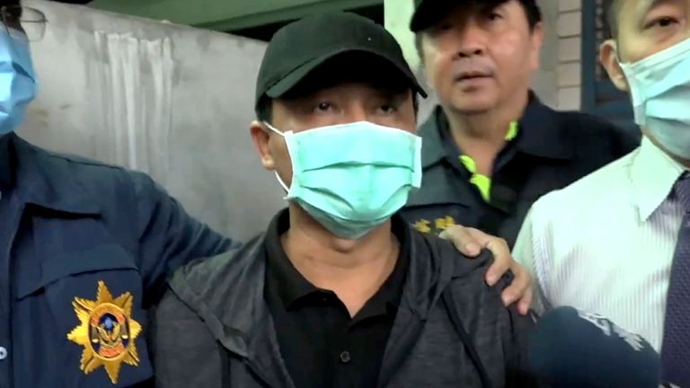 In this image taken from video, Lee Yi-hsiang, the driver of the truck that caused the train accident on Saturday, offers a public apology as he is led by police Sunday, April 4, 2021, in Hualien, Taiwan. Lee&#39;s truck slid into the path of an oncoming train, causing Taiwan&#39;s worst railway accident in decades that which killed dozens of people, and injuring hundreds more. (EBC via AP)