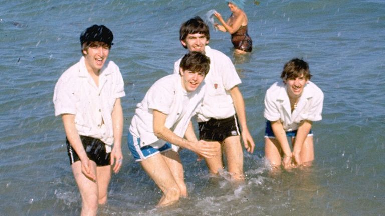 The Beatles - John Lennon, Paul McCartney, George Harrison and Ringo Starr - in the water in Nassau, Bahamas, during filming of Help! in 1965. Pic: AP


