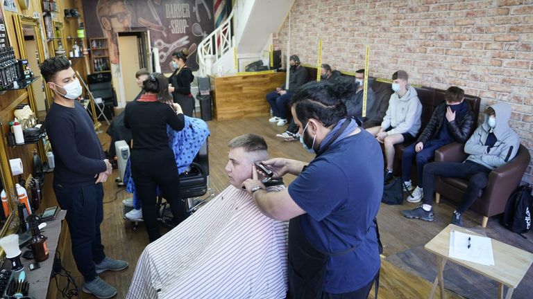 People get their hair cut at the Unique Traditional barber&#39;s in Whitley Bay, as England takes another step back towards normality with the further easing of lockdown restrictions. Picture date: Monday April 12, 2021.