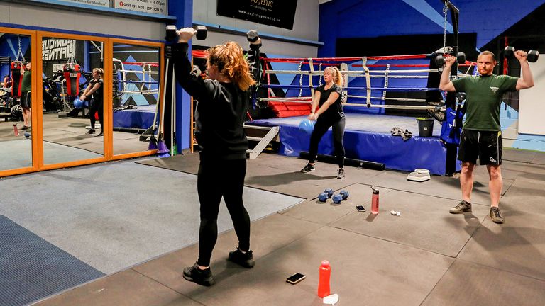 People attend a strength and conditioning class at Ultimate Fitness Gym as coronavirus disease (COVID-19) lockdown restrictions begin to ease, in Wallsend, Britain, April 12, 2021. REUTERS/Lee Smith    REFILE - QUALITY REPEAT