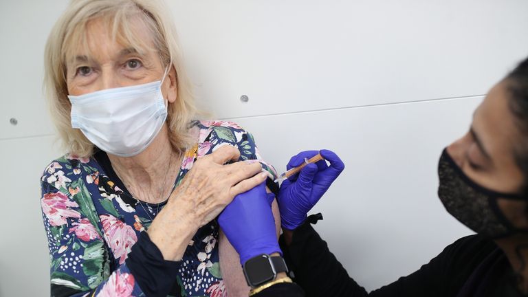 Pharmacist Asha Fowells vaccinates Catherine Jinadu, aged 82, with her second dose of the Oxford-AstraZneca vaccine