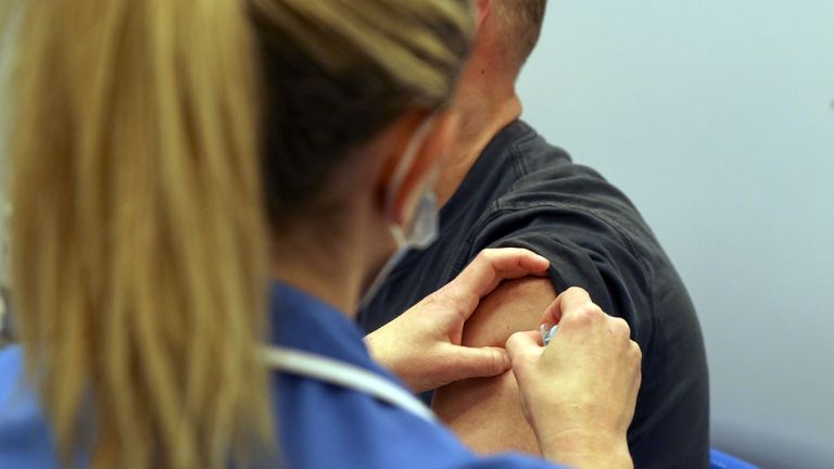 Mark Nicolls receives an injection of the Moderna Covid-19 vaccine administered by nurse Amy Nash, at the Madejski Stadium in Reading, Berkshire. The Moderna vaccine is the third to be approved for use in the UK, and is now being given to patients in England. Picture date: Tuesday April 13, 2021.