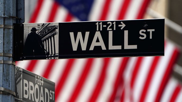 A Wall Street sign is pictured outside the New York Stock Exchange amid the coronavirus disease (COVID-19) pandemic in the Manhattan borough of New York City, New York, U.S., April 16, 2021.