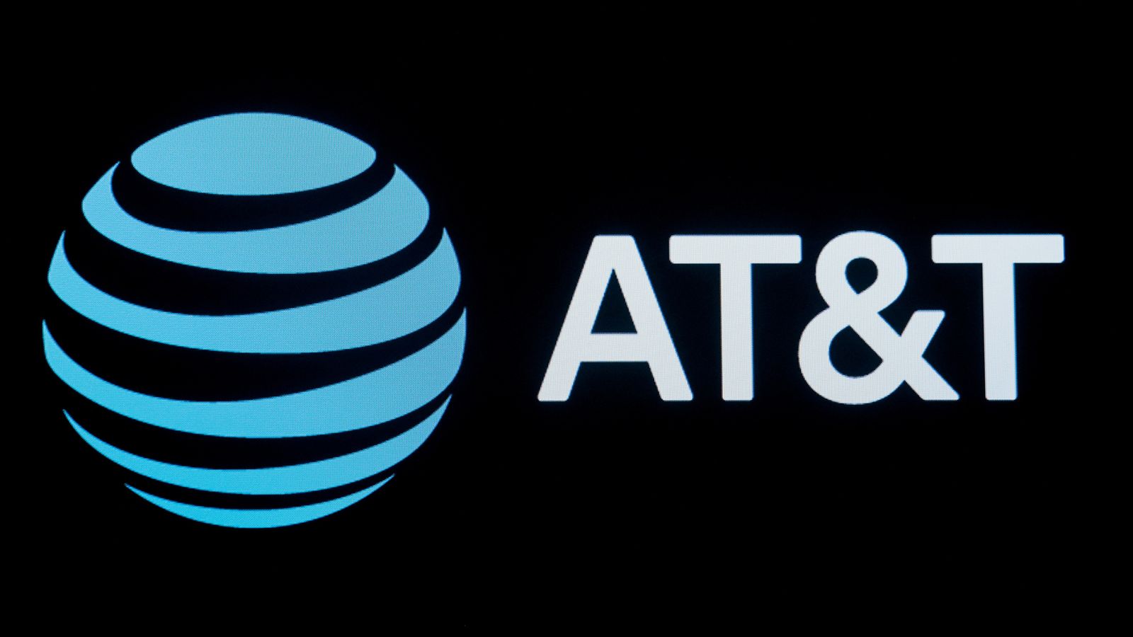 The company logo for AT&T is displayed on a screen on the floor at the ...