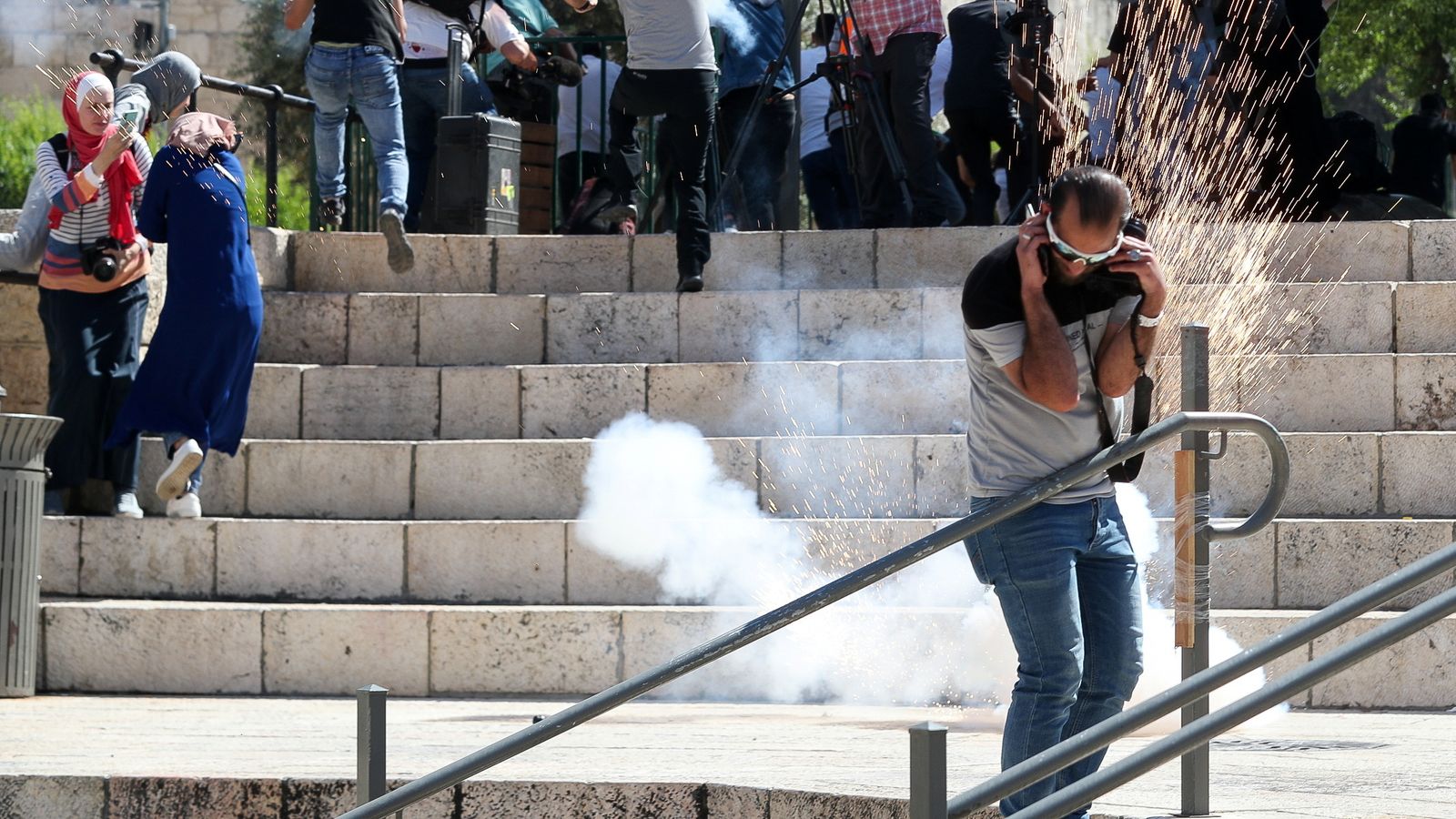 Palestinian protesters dodge stun grenades and 'skunk' spray as skirmishes spread through Jerusalem's Old City