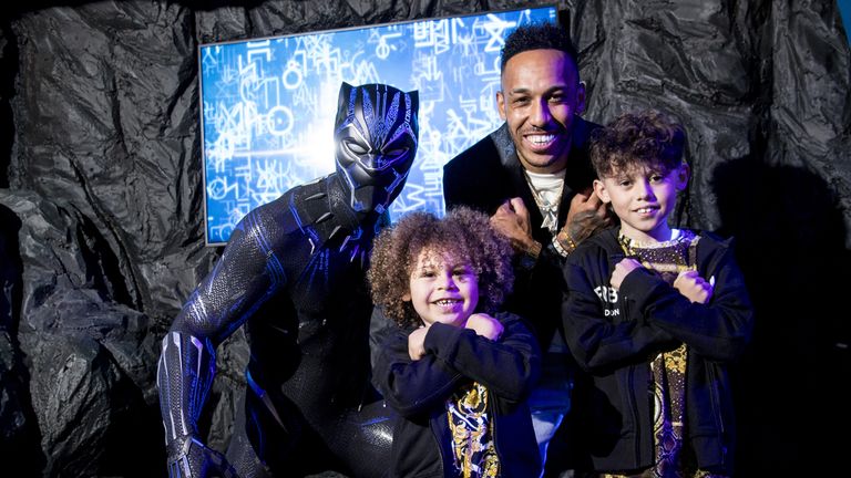 Pierre-Emerick Aubameyang, with his sons Pierre and Curtys, unveiling the new Black Panther wax figure at Madame Tussauds in central London. Picture date: Thursday May 13, 2021.