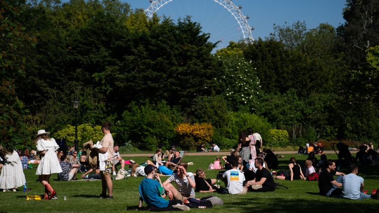 Members of the public enjoy the sun in St James Park, with the bank holiday weekend expected to bring blue skies and widespread sunshine. Picture date: Sunday May 30, 2021.