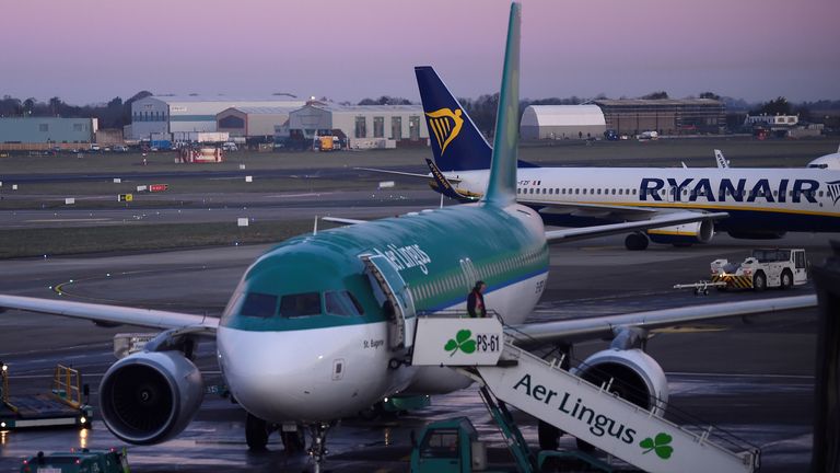 Passengers disembark from Aer Lingus and Ryanair aircraft at Dublin airport at dawn in Dublin, Ireland March 20, 2018. Picture taken March 20, 2018. REUTERS/Clodagh Kilcoyne/File Photo