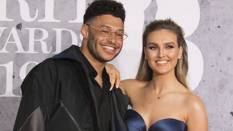 Perrie Edwards and her partner Alex Oxlade-Chamberlain have announced they are expecting their first child. Pic: Vianney Le Caer/Invision/AP