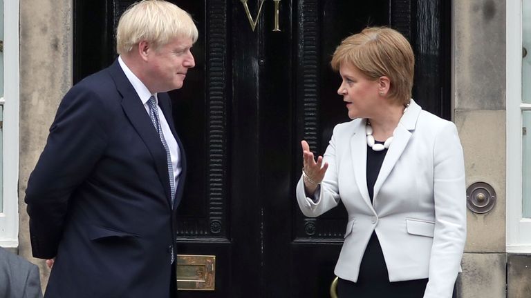 Scotland&#39;s First Minister Nicola Sturgeon welcomes Prime Minister Boris Johnson outside Bute House in Edinburgh