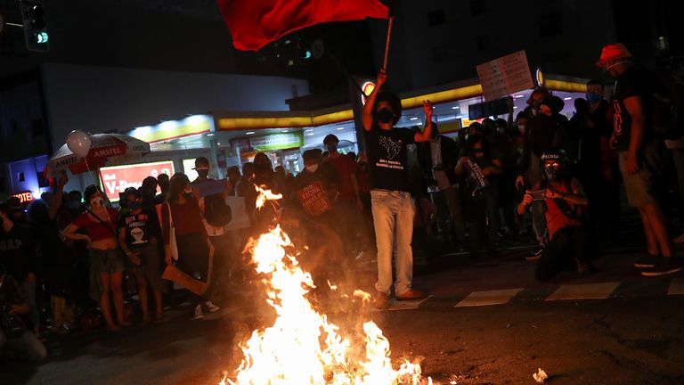 Protestors in Sao Paulo burned a doll depicting Mr Bolsonaro during the demonstration