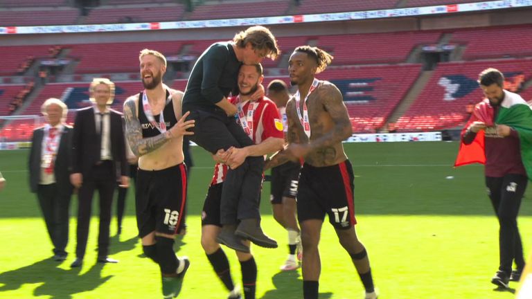 Brentford head coach Thomas Frank was carried off by his players during an interview with Sky Sports. 