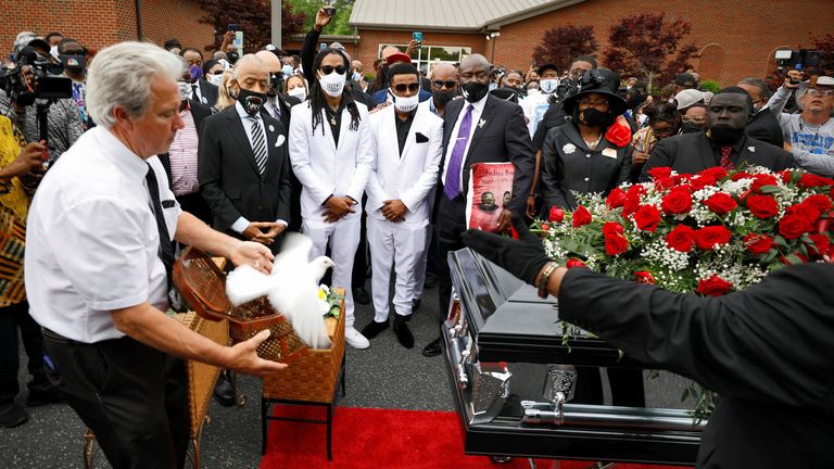 A dove representing the soul of Andrew Brown Jr. is released as his sons Khalil and Jha&#39;rod Ferebee, other family members and the Reverend Al Sharpton watch at the conclusion of the funeral in Elizabeth City, North Carolina, U.S., May 3, 2021. REUTERS/Jonathan Drake