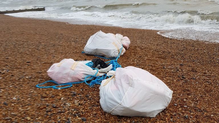 Passers-by on a beach near Hastings discovered large bags containing a tonne of cocaine. Pic: NCA