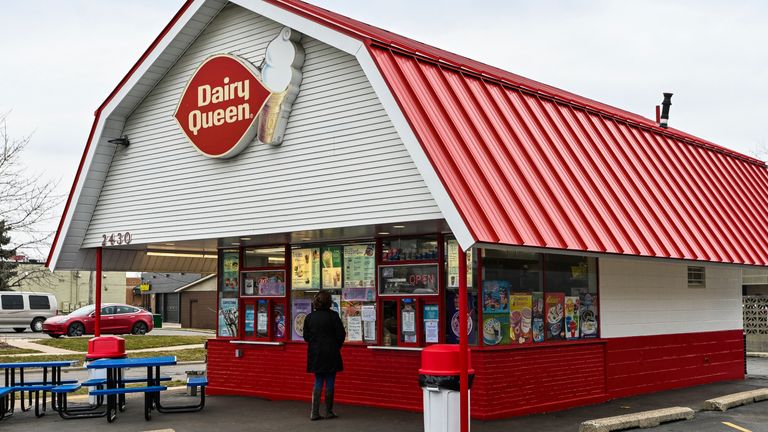 This local Dairy Queen restaurant has sign posted Open For Take Away while customers are asked to stand away from the window while ordering during the State of Michigan mandated COVID-19 Coronavirus closure period on Thursday March 19, 2020 in Ann Arbor, MI. Pic: AP