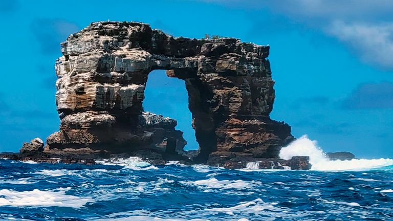 This photo distributed by Galapagos National Park shows Darwin&#39;s Arch off the Galapagos Islands, Ecuador, Sunday, May 16, 2021. Ecuador’s Environment Ministry reported the collapse of the top of the arch on its Facebook page on Monday, May 17, and blame natural erosion of the stone. (Galapagos National Park via AP)