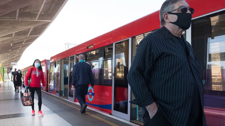 Commuters on the Docklands Light Railway in London after the introduction of measures to bring the country out of lockdown. 20/5/2020