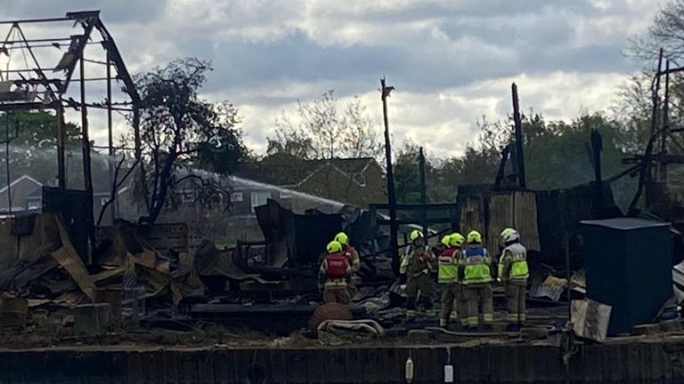 Firefighters have been damping down after putting out the flames