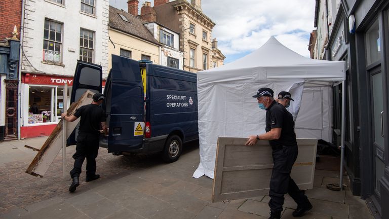 Police were seen carrying objects out of the cafe