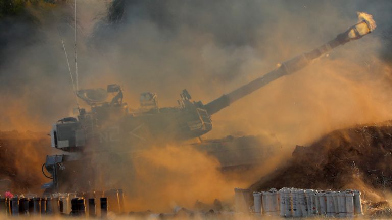 An Israeli artillery unit fires toward targets in Gaza Strip, at the Israeli Gaza border, Thursday, May 13, 2021. (AP Photo/Ariel Schalit)                     