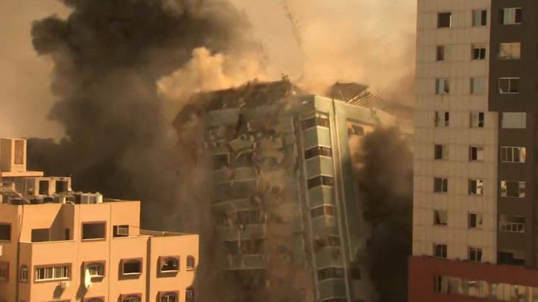 Media building collapses in Gaza City after being bombed by Israeli forces