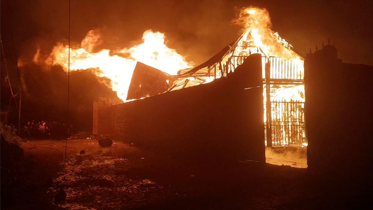 A building burns after the volcanic eruption of Mount Nyiragongo, which occurred late on May 22, 2021, in Goma, Democratic Republic of Congo. Pic: ENOCH DAVID via REUTERS