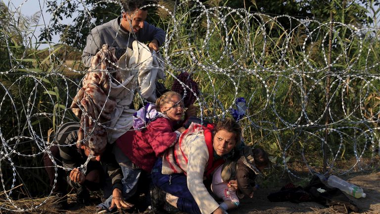 Mr Orban&#39;s government put up razor wire on the Hungarian border in 2015 to try to prevent migrants, like these from Syria, from entering