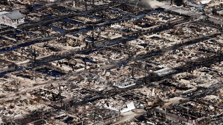 This aerial photo shows the Breezy Point neighborhood, in New York, Wednesday, Oct. 31, 2012, where more than 50 homes were burned to the ground Monday night as a result of superstorm Sandy. Sandy, the storm that made landfall Monday, caused multiple fatalities, halted mass transit and cut power to more than 6 million homes and businesses. (AP Photo/Mark Lennihan)