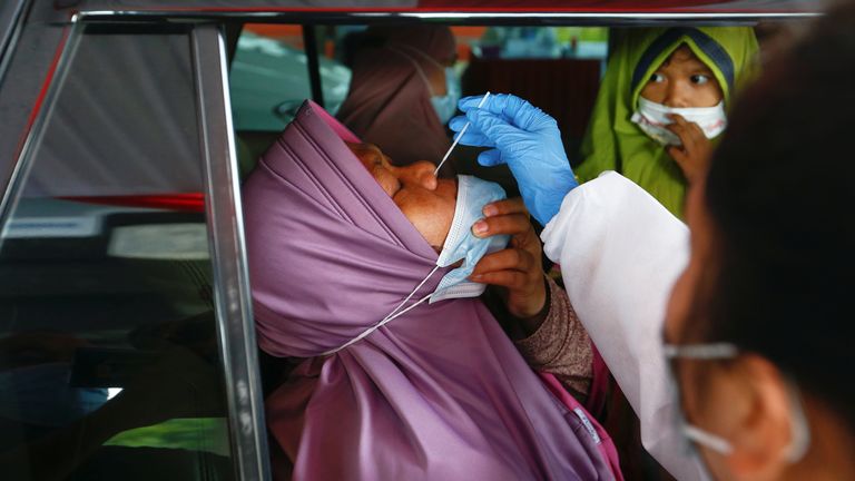 Indonesian Muslims returning from Eid holidays are being tested at roadblocks
