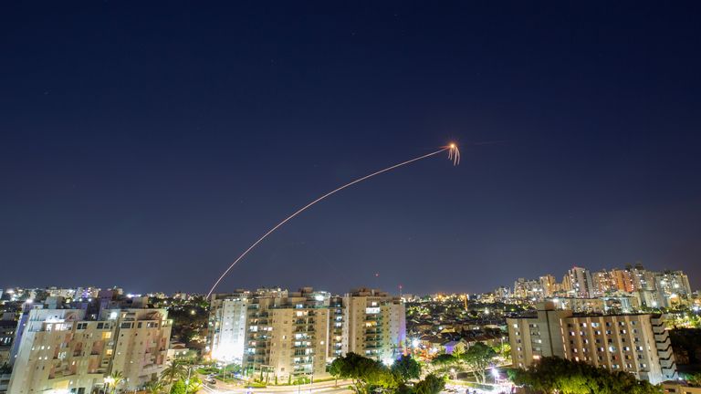 Streaks of light are seen as Israel&#39;s Iron Dome anti-missile system intercepts rockets launched from the Gaza Strip towards Israel, as seen from Ashkelon, Israel May 14, 2021. REUTERS/Amir Cohen